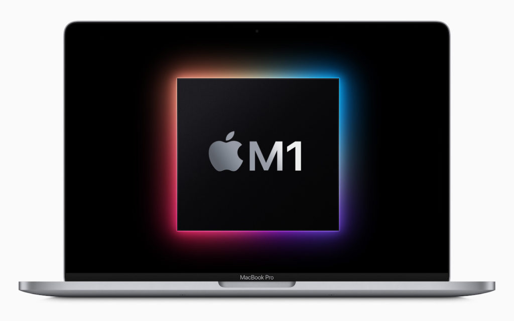 A MacBook Pro laptop displays a glowing square with the Apple logo and M1 text at the center of the screen, representing Apples M1 chip.