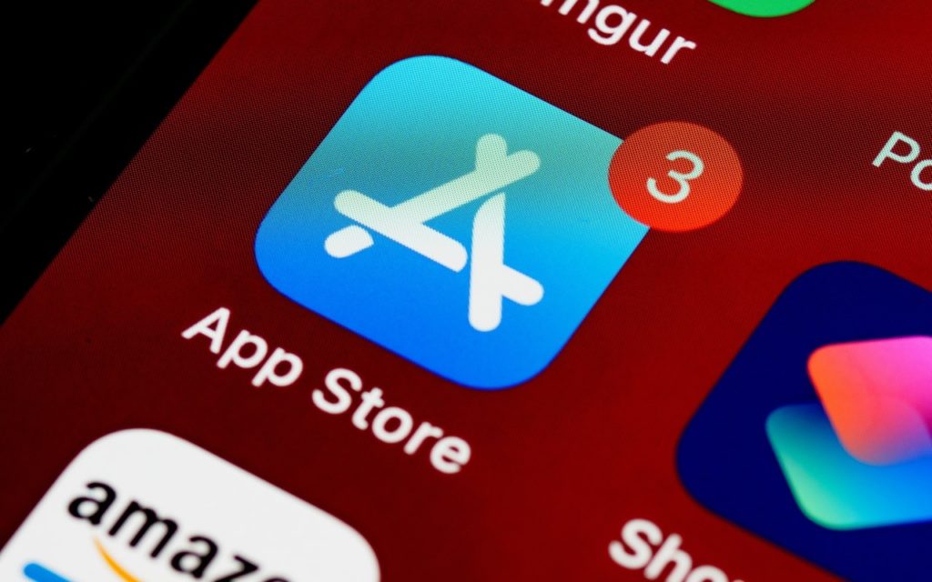 Close-up of the App Store icon on a smartphone screen, with a red notification badge showing the number 3 in the top right corner, indicating three available updates.