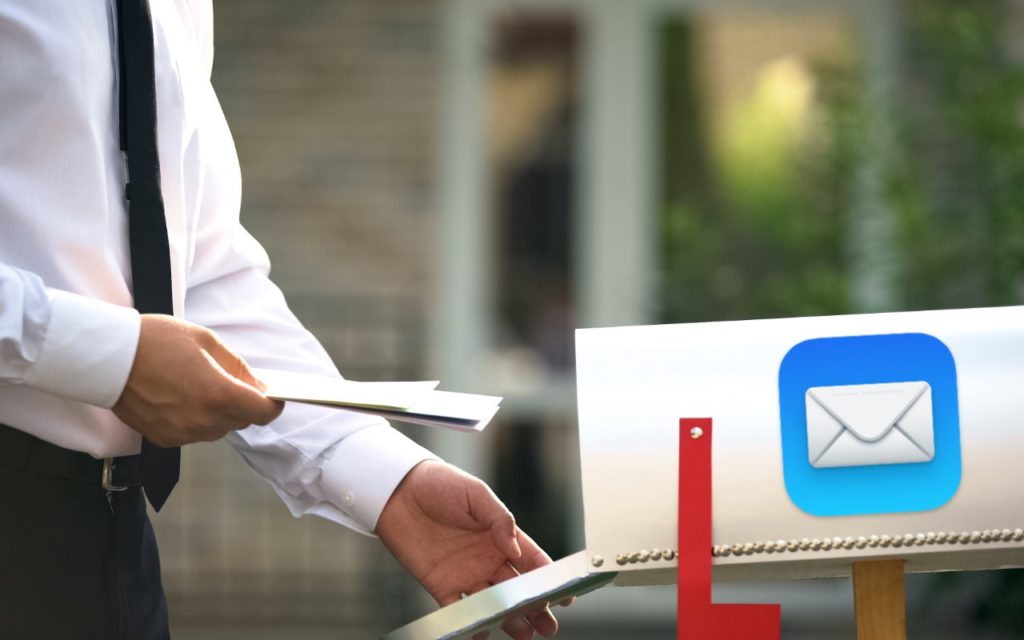 A person in a white shirt and tie places letters into a mailbox with a large blue email app icon on the side, representing the concept of email or digital communication.