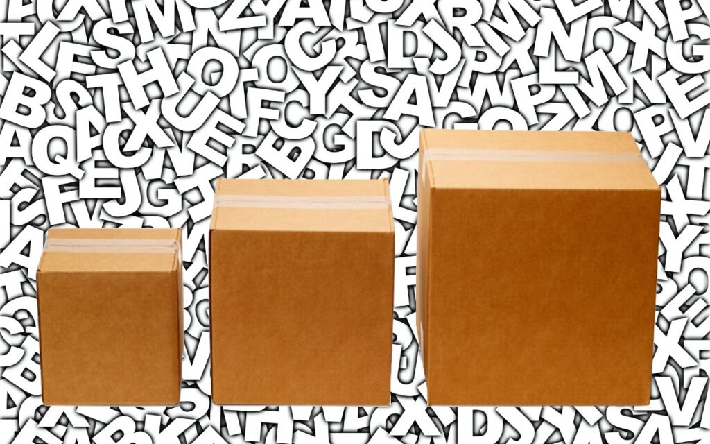 Three cardboard boxes of different sizes are lined up, set against a background filled with random overlapping white letters outlined in black—did you know text entry boxes in web browsers are easy to expand?.