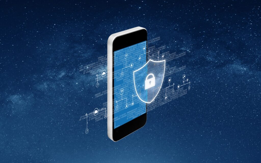 A smartphone displays digital graphics and a glowing shield icon with a padlock, symbolizing data protection and cybersecurity—perfect for illustrating how to Restrict Access to Sensitive Apps in iOS 18 and iPadOS 18, set against a starry night sky.