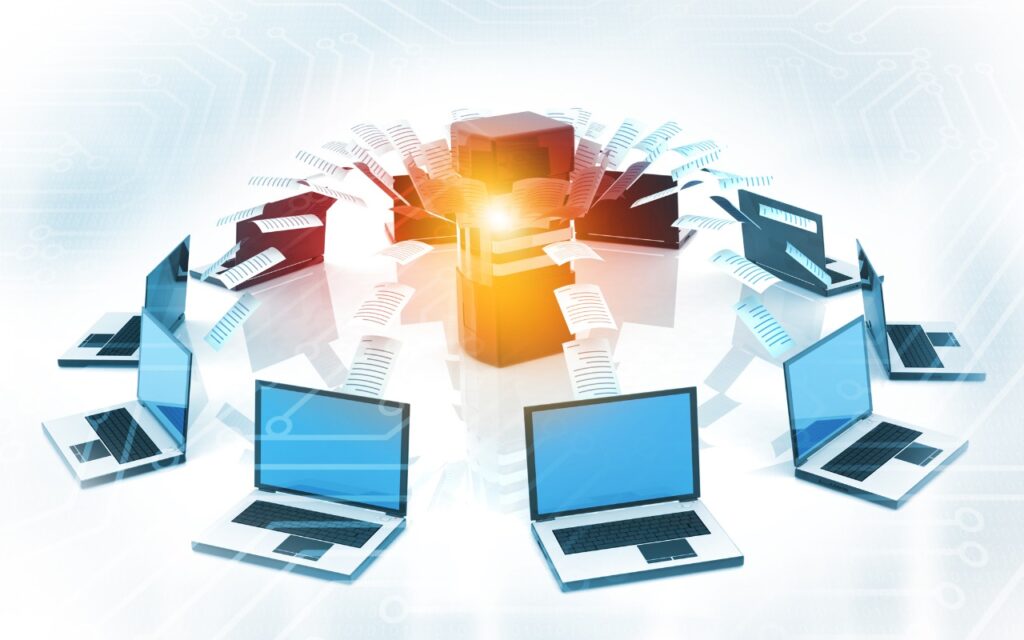 A circle of laptops connected to a central server, with digital files transferring between them, symbolizes networked data sharing or cloud computing—reminding businesses not to overlook email backup as part of their strategy.